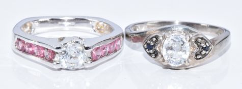 Two 9k white gold rings, one set with topaz and pink tourmaline and the other zircon and blue