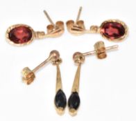 Two pairs of 9ct gold earrings, one pair set with garnets and the other with sapphires, 1.7g