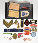 Approximately 70 cloth shoulder titles and insignia including Royal Lincolnshire, East Anglia, Royal