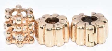 Three 14k gold Pandora charms, 5.7g