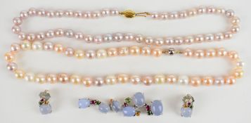 Two strings of cultured pearls, one with a 9k gold clasp and the other a silver clasp, together with
