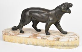 Bronze panther / tiger raised on an oval marble base, H19 x L29cm