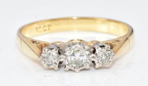 An 18ct gold ring set with three diamonds, 3g, size L