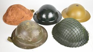 Five British 'Brody' helmets, some reproductions, including examples with liners, chinstraps,