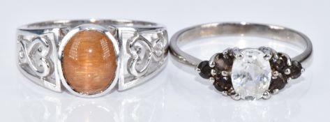 Two 9ct white gold rings, one set with a star sunstone and the other a zircon and smoky quartz, with