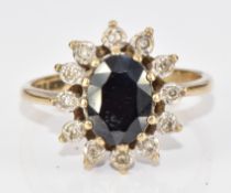 A 9ct gold ring set with an oval sapphire of approximately 1.4ct surrounded by diamonds, 2.4g,