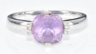 A 9ct gold ring set with an oval amethyst and diamonds, 2.8g, size J/K