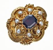 Victorian brooch set with a foiled emerald cut garnet and split pearls, verso a locket