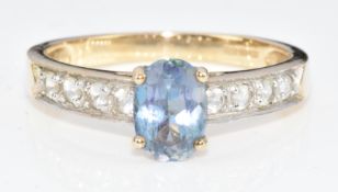 A 9ct gold ring set with an oval cut Neptune topaz, 2.3g, size N