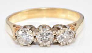 An 18ct gold ring set with three diamonds totalling approximately 0.9ct, 4.6g, size Q