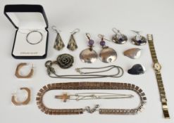 A collection of silver jewellery including four pairs of earrings, two necklaces and two pendants on