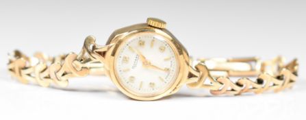 Rotary 9ct gold ladies wristwatch with gold hands and hour markers, silver dial and 15 jewel