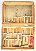 Large collection of wood turning and carving tools in a fitted metal bound box, including Marple and