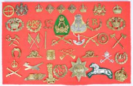 Forty military badges, pips and insignia including Tank Regiment, Observer Corps, Pioneers, Royal