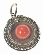 Victorian mourning pendant /locket set with a coral bead, verso a glass compartment and engraved '