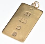 A 9ct gold ingot pendant with feature hallmarks, London 1976, 14.7g, 4.5 x 2.5cm