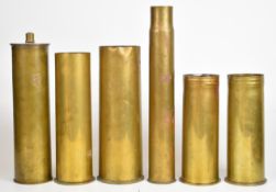 Six various WW1 and WW2 brass shell cases including examples from Germany, with dates from 1916,