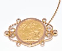 An 1887 gold full sovereign mounted in a 9ct gold brooch, 11.7g, 4cm