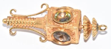A 9ct gold charm in the form of a lamp, 7.2g, 3.8cm