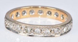 A 9ct gold eternity ring set with diamonds (two diamonds missing), 2.6g, size M/N