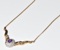 A 9ct gold necklace set with an oval amethyst and diamonds, 9.2g, 40cm