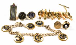 A 14k gold pin set with onyx and a diamond (1.3g), four 9ct gold pins (4.3g) four silver gilt pins