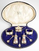George V hallmarked silver cruet set, comprising mustard, two salts, two peppers and three spoons,