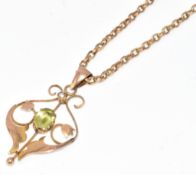Edwardian 9ct gold pendant set with peridot and a split pearl, on 9ct chain, 4.3g, 52cm
