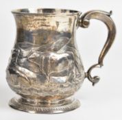 Georgian hallmarked silver pint tankard of baluster form with embossed decoration of cattle in a