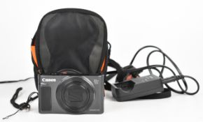 Canon PowerShot SX620HS 20.2MP compact digital camera, together with battery charger