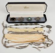 A collection of silver jewellery including two brooches, tassel charm, necklaces, 130g together with