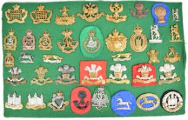 Approximately 38 cap badges including Royal Gloucestershire Hussars, King's Dragoon Guards,