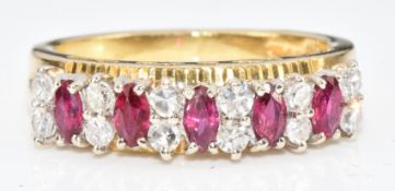 An 18ct gold ring set with marquise cut rubies and diamonds, 4.9g, size L