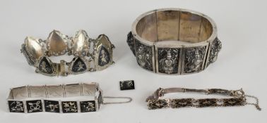 A white metal Nepalese/ Thai bracelet, two Siam silver bracelets and Japanese silver bracelet, 135g