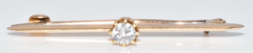 A 15ct gold brooch set with a round brilliant cut diamond of approximately 0.2ct, 2.2g, 3.8cm
