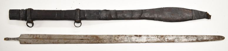 North African style sword, potentially Tuareg with 90cm blade, in leather scabbard decorated with
