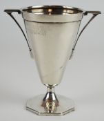 Art Deco hallmarked silver twin handled trophy cup of plain tapering form on an octagonal base,