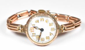 Unnamed 9ct gold ladies wristwatch with luminous blued hands, Arabic numerals, white dial,