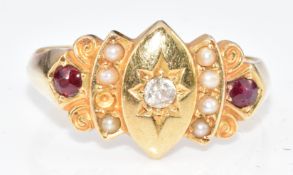 An 18ct gold c1900 ring set with a diamond, split pearls and two rubies, 4.3g, size L