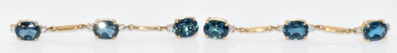 A pair of 9ct gold earrings set with London blue topaz and diamonds, with certificate, 9.6g