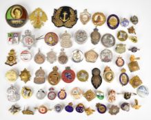 Approximately 60 military buttons, pips and badges, including three hallmarked silver ARP badges,