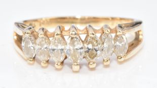 A 14k gold ring set with seven graduating marquise cut diamonds, 4.2g, size P/Q