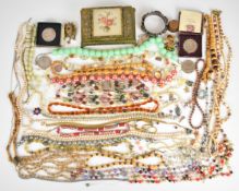 A collection of jewellery including vintage necklaces, brooches, white metal bangle set with