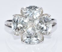 A 9k white gold ring set with four trilliant cut green amethysts, with certificate, 3.3g, size N/O