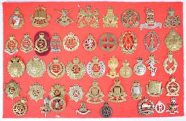 Approximately 45 cap badges and insignia including Rhodesian Long Range Desert Group (LRDG), 1st
