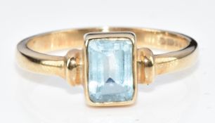 A 9ct gold ring set with an emerald cut topaz, 2.6g, size P