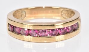 A 9ct gold ring set with garnets, 3.2g, size M