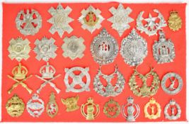 Twenty Seven military cap badges and insignia, approximately fourteen Scottish regiments including