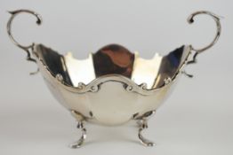 Victorian or Edward VII hallmarked silver twin handled sugar bowl, with faceted body, scroll handles