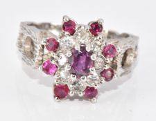 An 18ct white gold ring set with rubies and diamonds in a cluster, 5.3g, size K